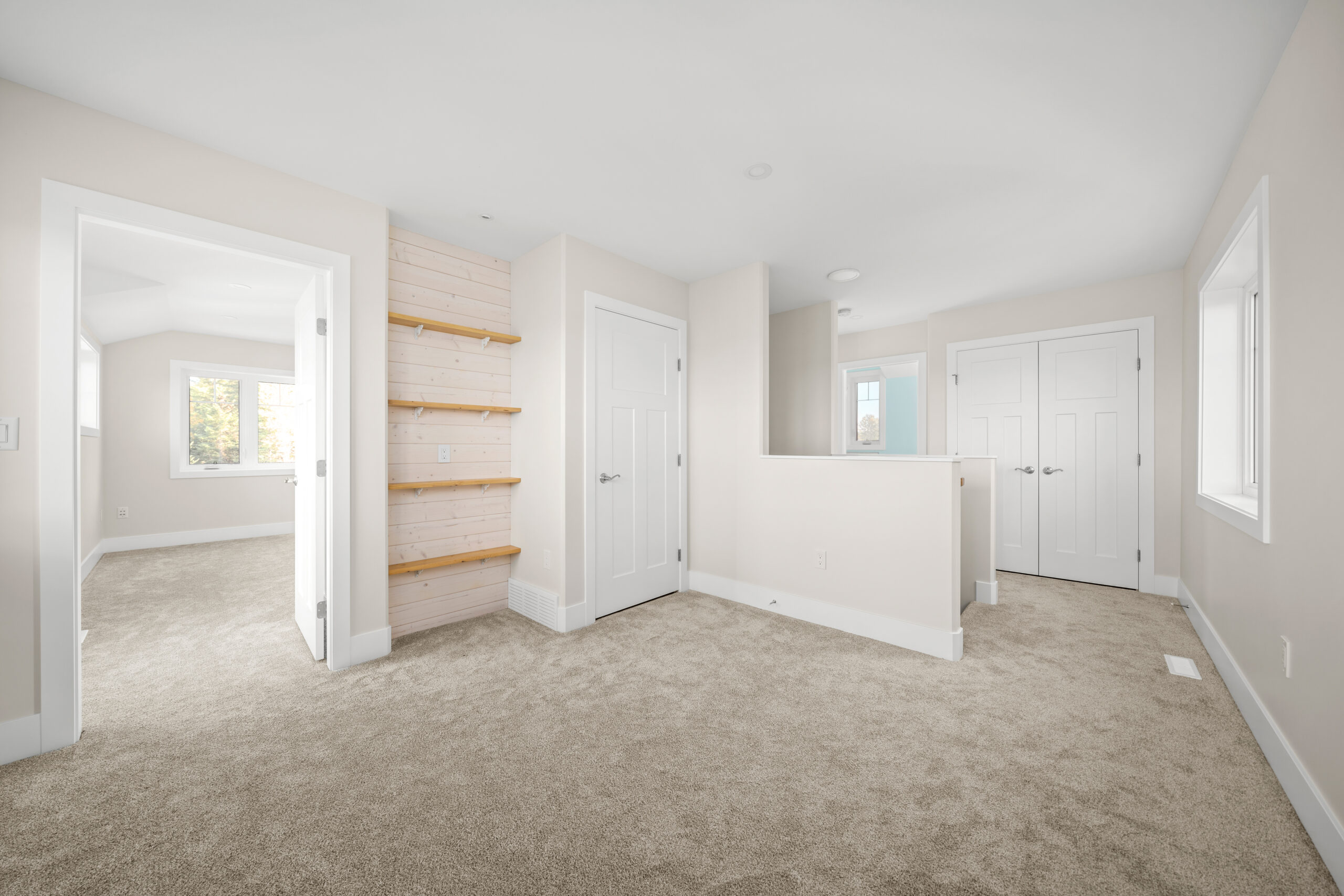 sitting area with built in open shelving