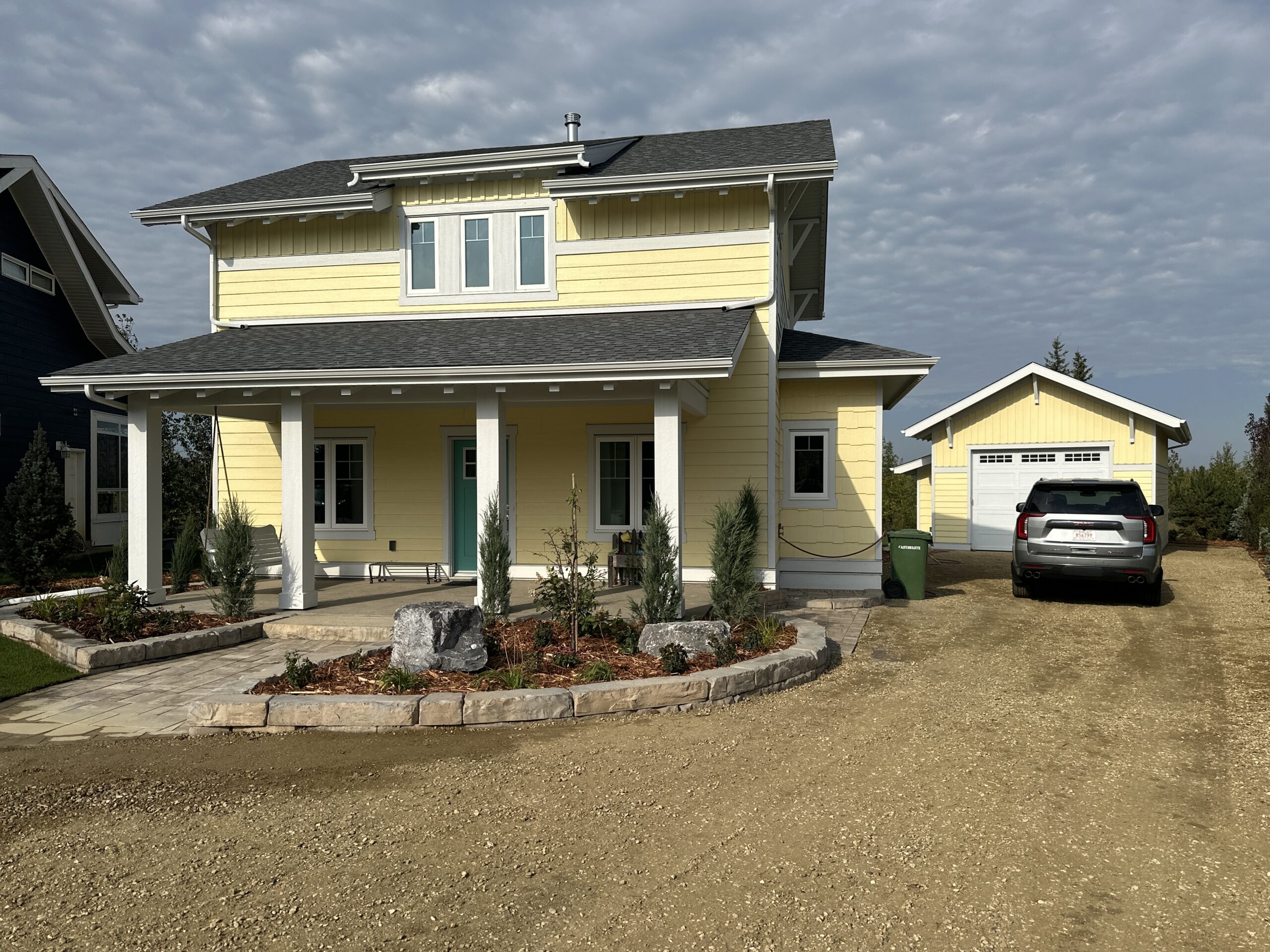 lakeside cottage home and gravel driveway