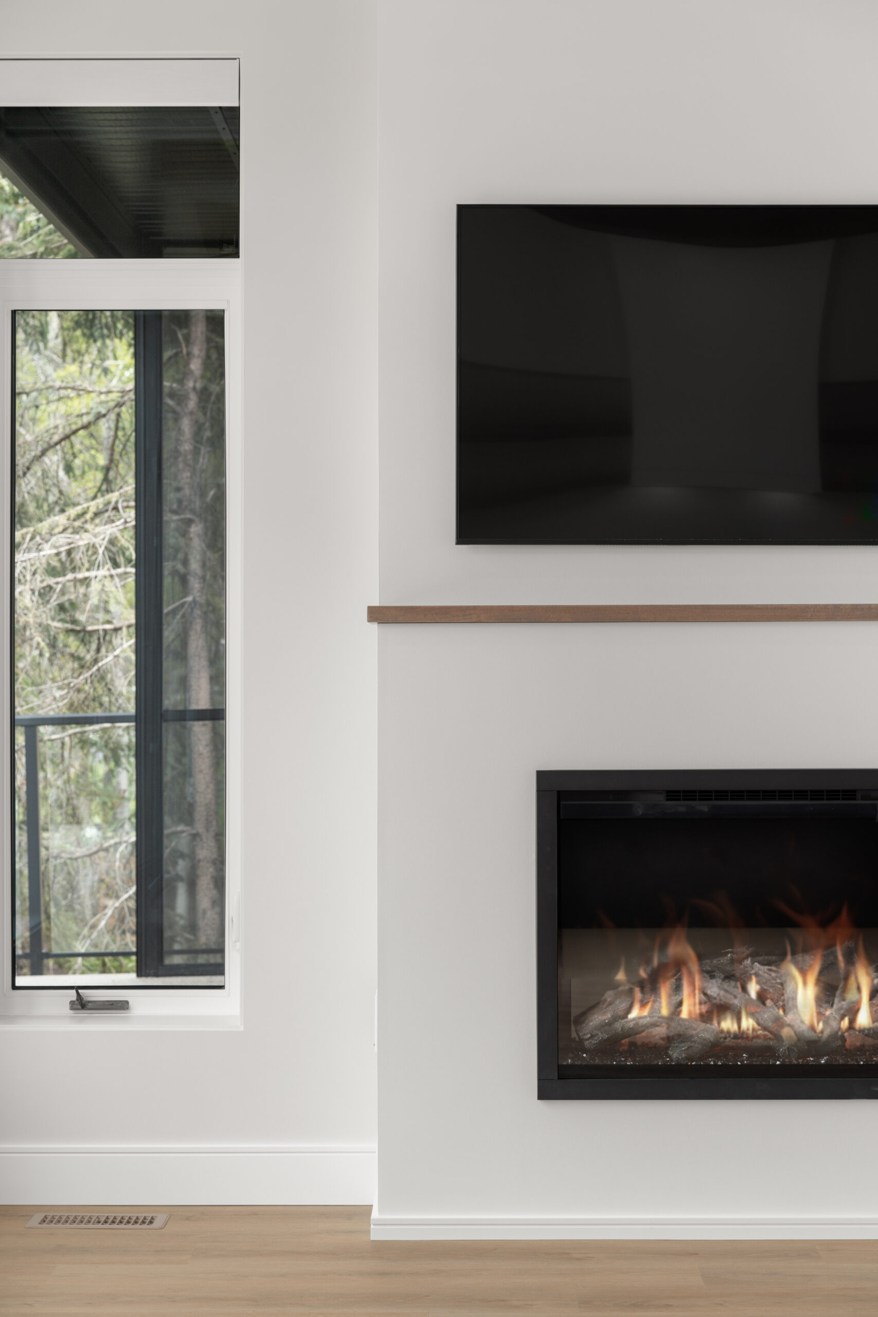 living room with close-up of an electric fireplace in a net zero home
