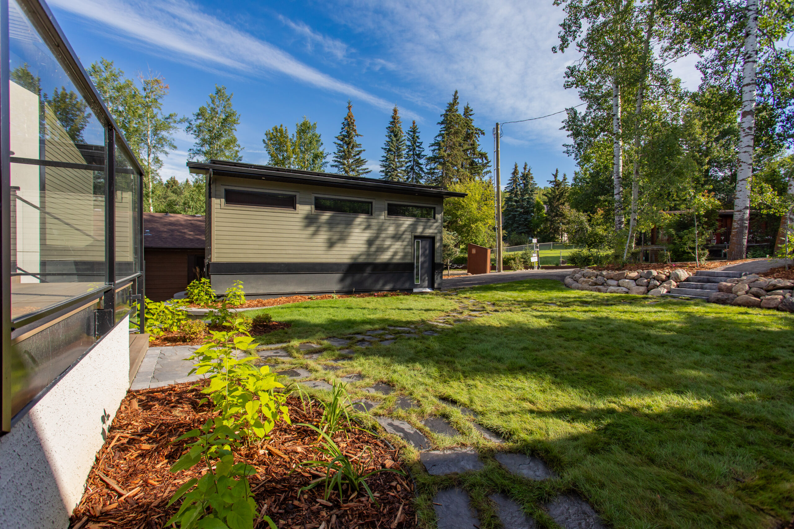 garage and landscaped yard in foreground