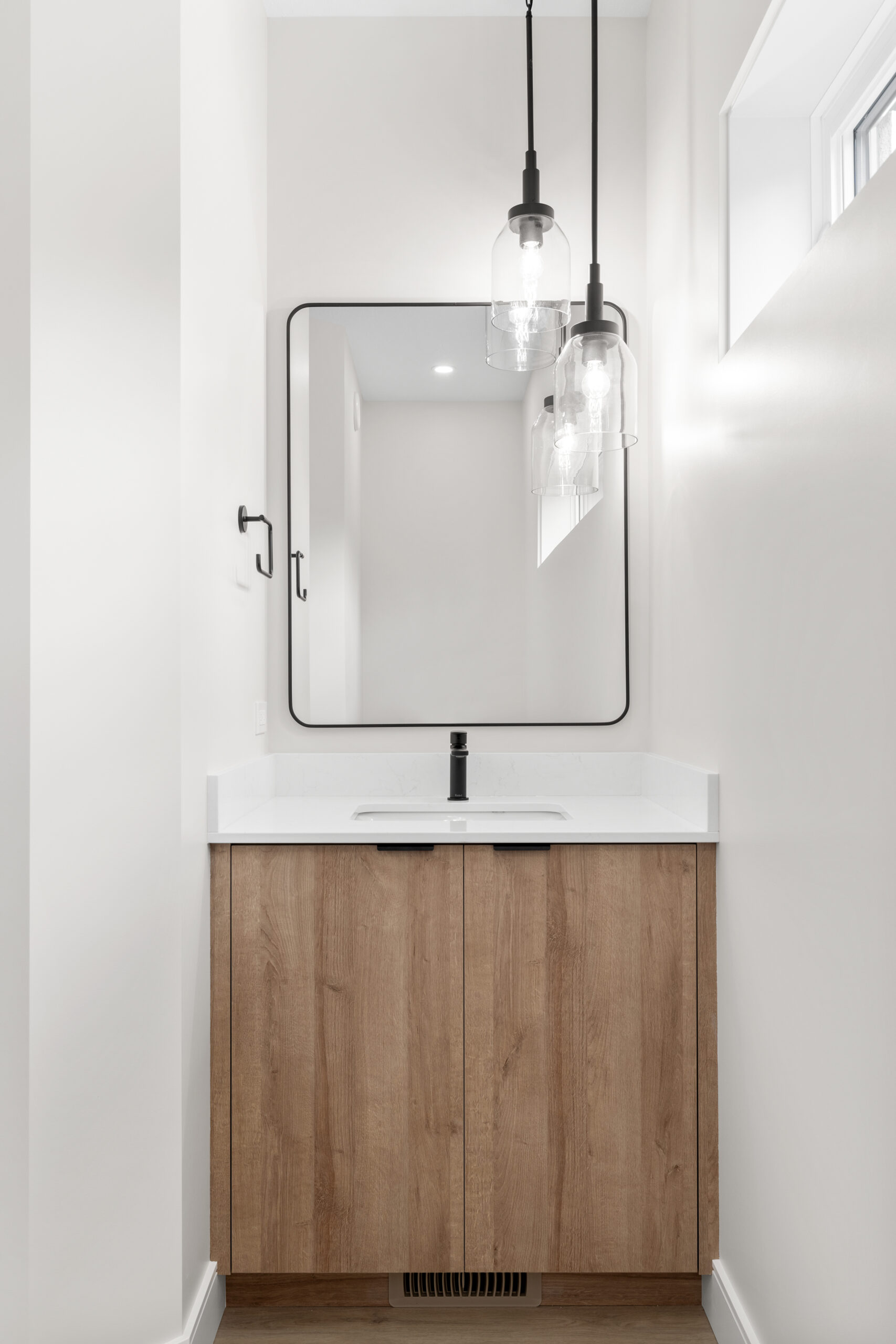 half-bath sink with mirror in a net zero home
