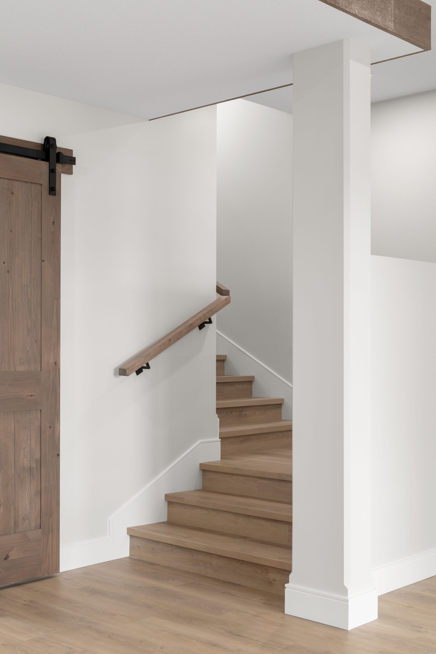stairs leading down to walk-out basement in a net zero home