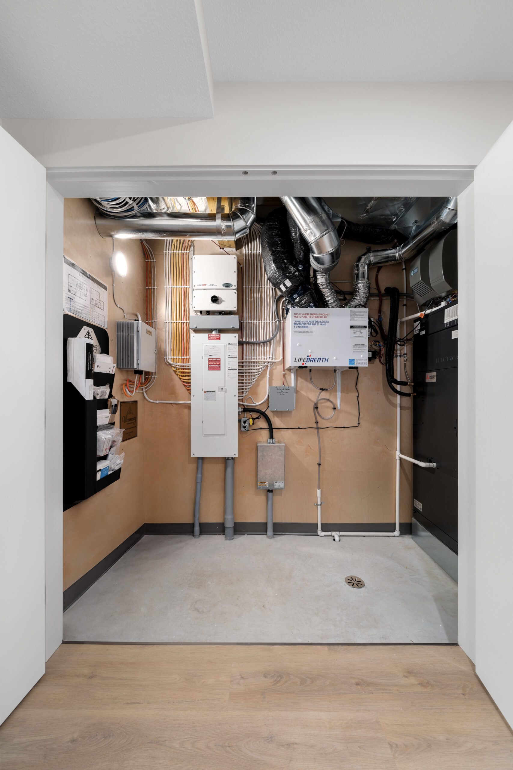 mechanical room in the walk-out basement of a net zero home