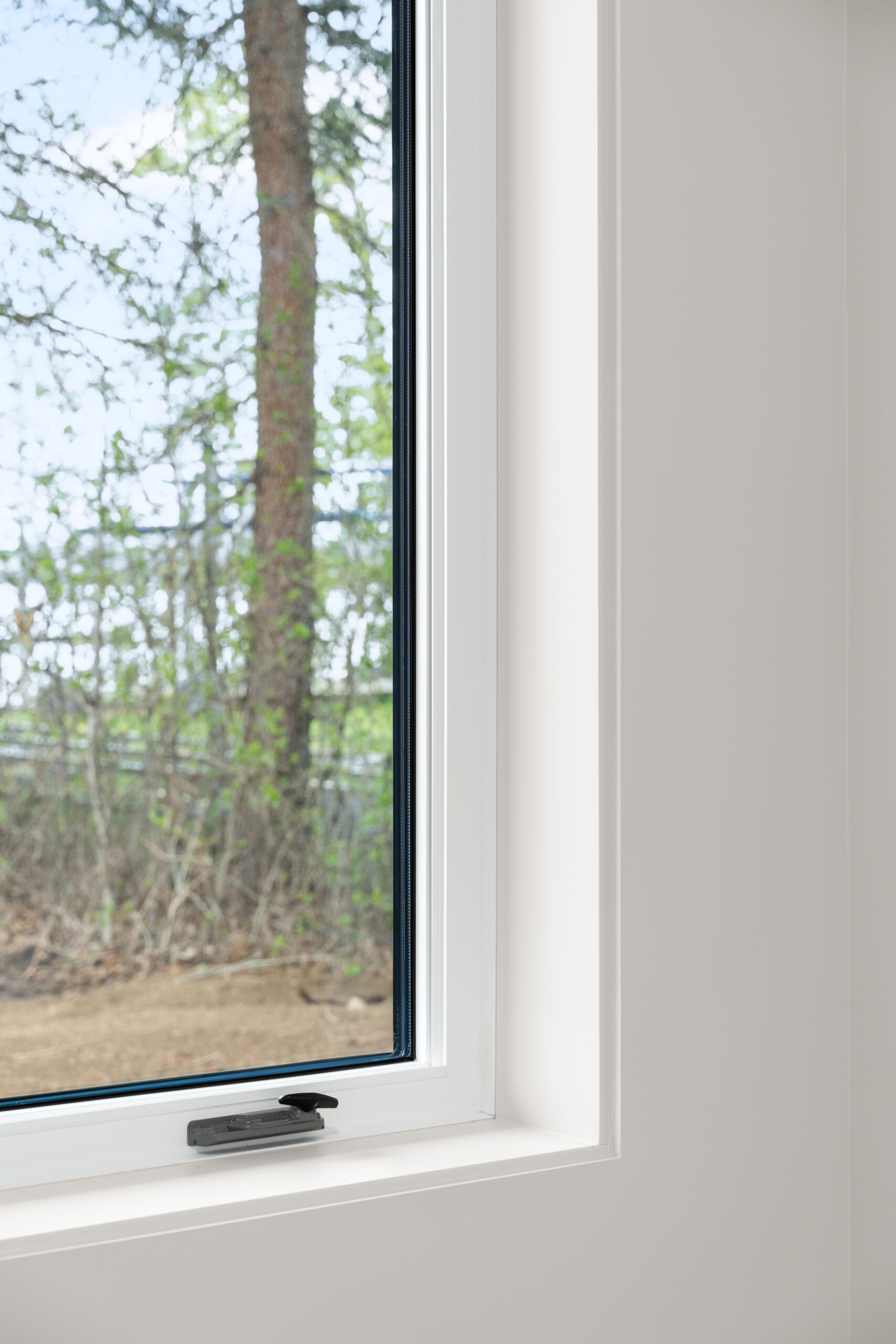 close-up of window in the walk-out basement of a net zero home
