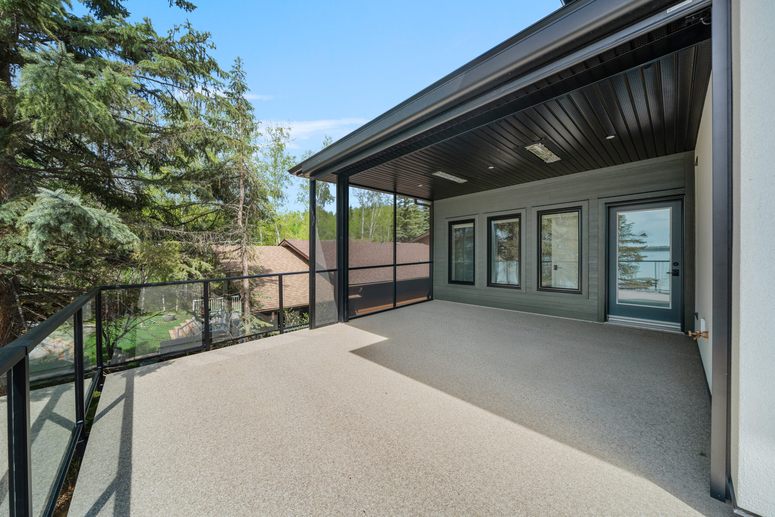 power retractable awning on second story deck rear exterior of a net-zero home