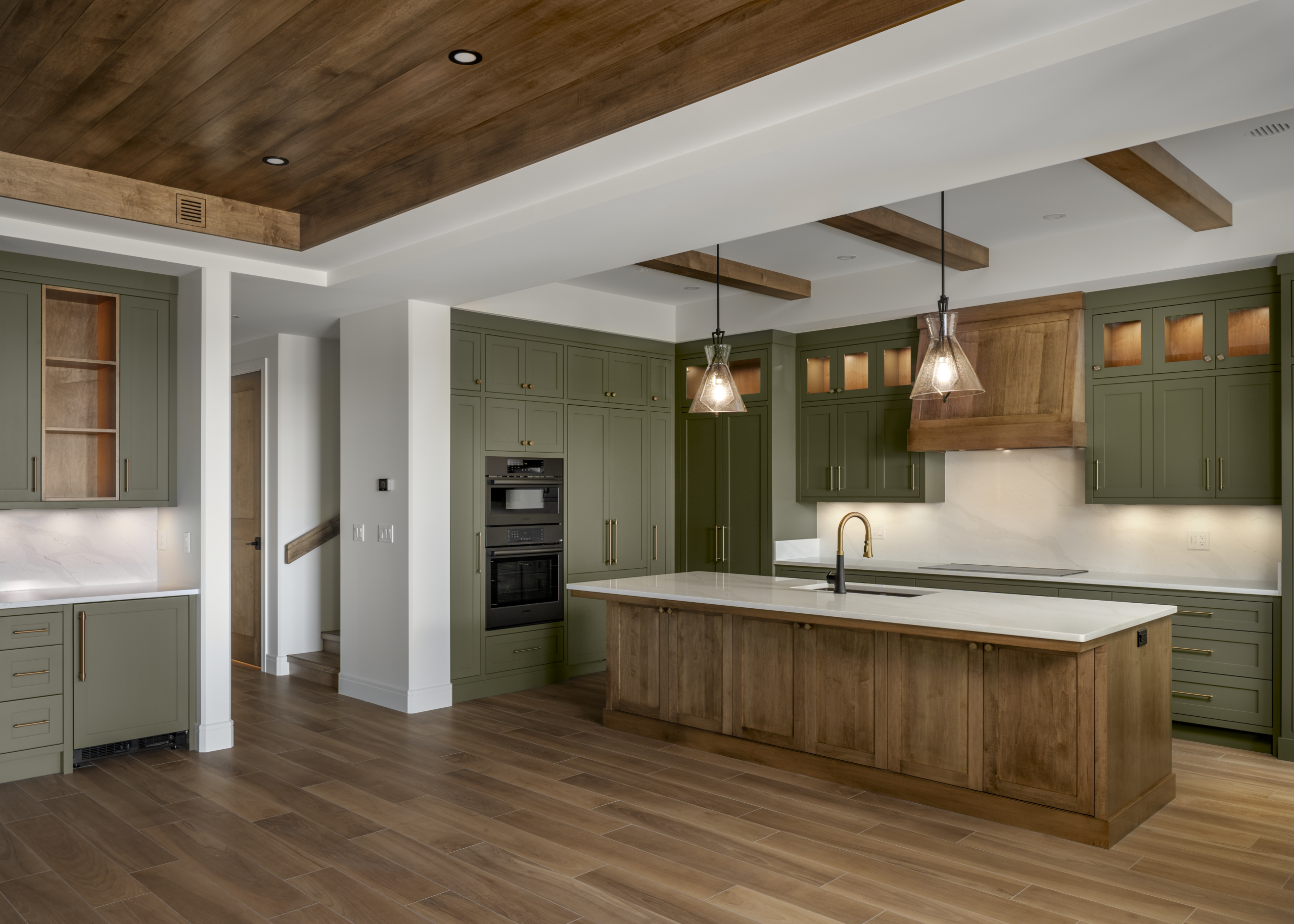 kitchen and bar counter in a high performance, energy efficient lakeside home designed and built by Vleeming Custom Homes in Poplar Bay at Pigeon Lake