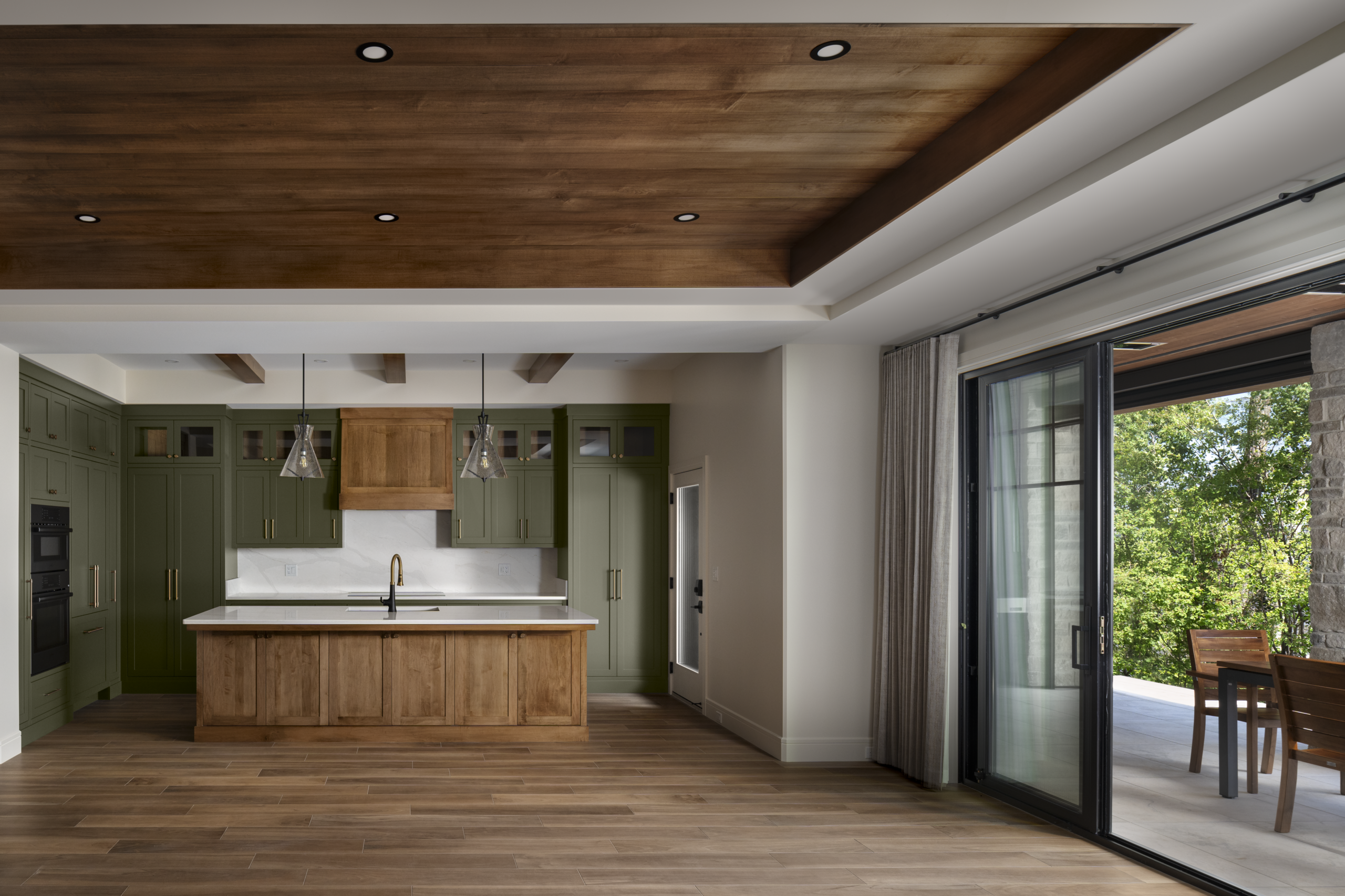 kitchen and dining room in a high performance, energy efficient lakeside home designed and built by Vleeming Custom Homes in Poplar Bay at Pigeon Lake