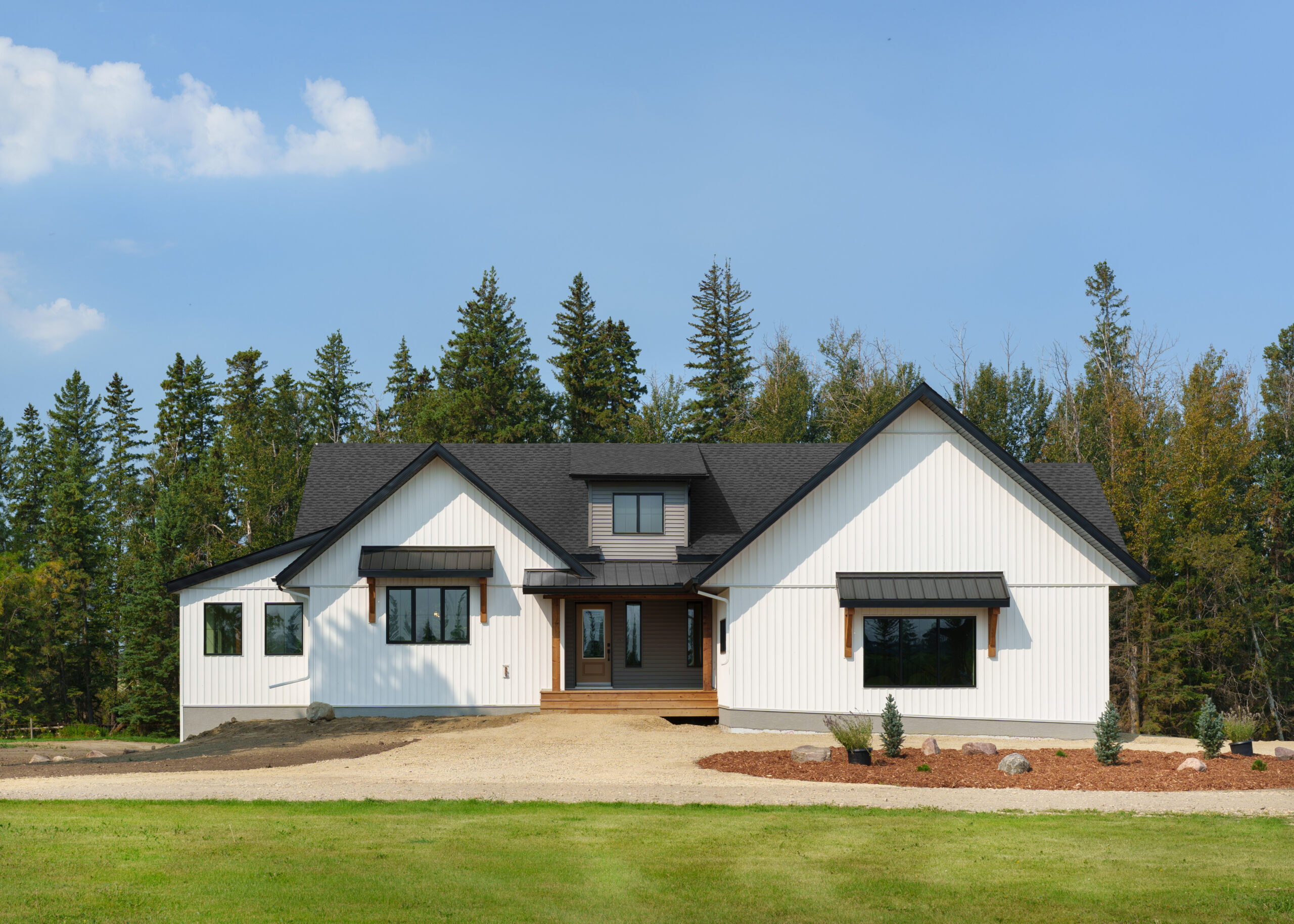 front view of a high performance, energy efficient modern farmhouse style home designed and built by Vleeming Custom Homes in Ponoka County